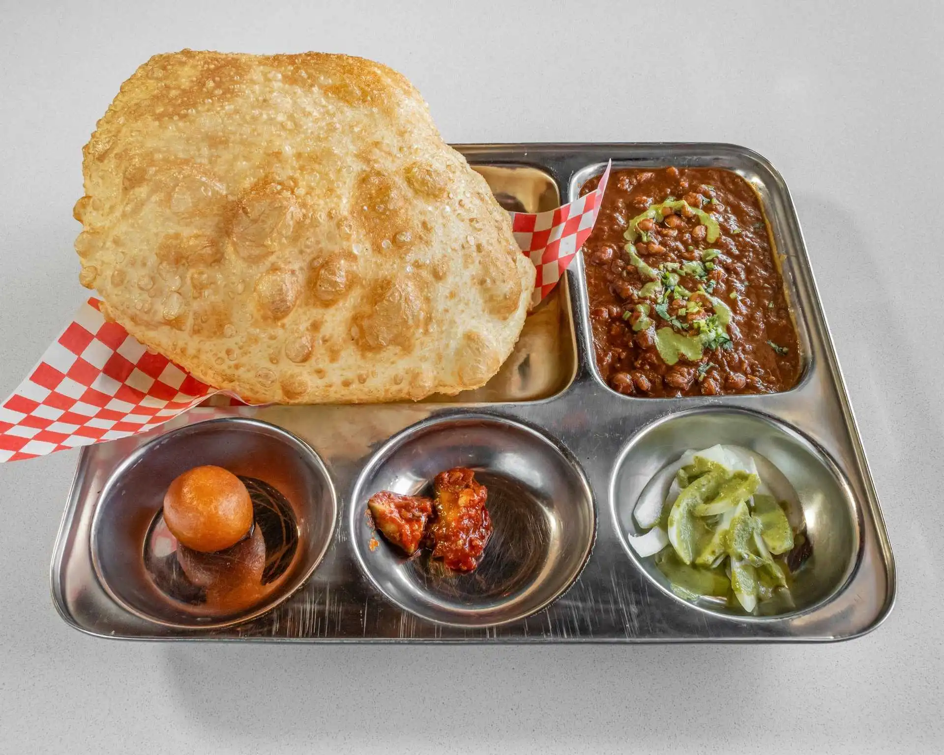 Combo platter with fried bread, curry, and sides at Dak Land Restaurant in Warman, Saskatchewan